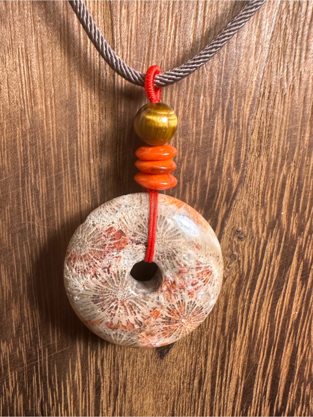 Handcrafted Red and Brown Coral Fossil Donut Pendant Necklace on Brown Rope - Picture 6 of 16